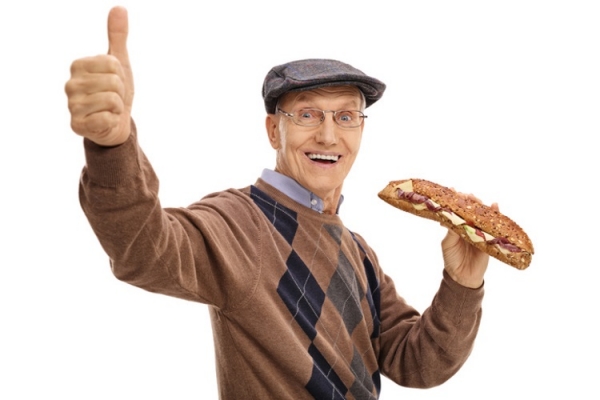 Older man eating sandwich thumbs up Ljupco