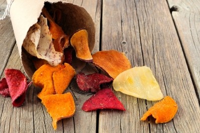 How do vegetable crisps compare to potato crisps, nutritionally? Image Source: Getty Images/Jenifoto